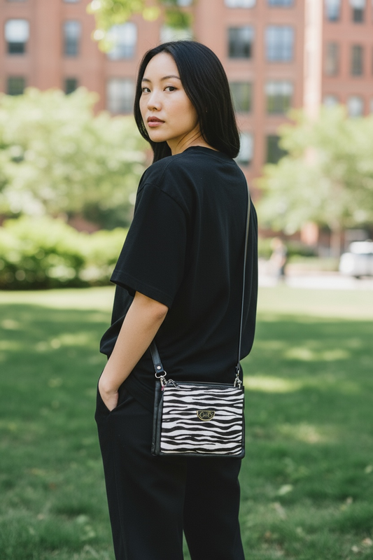 Spyder zebra and black print cross body bag