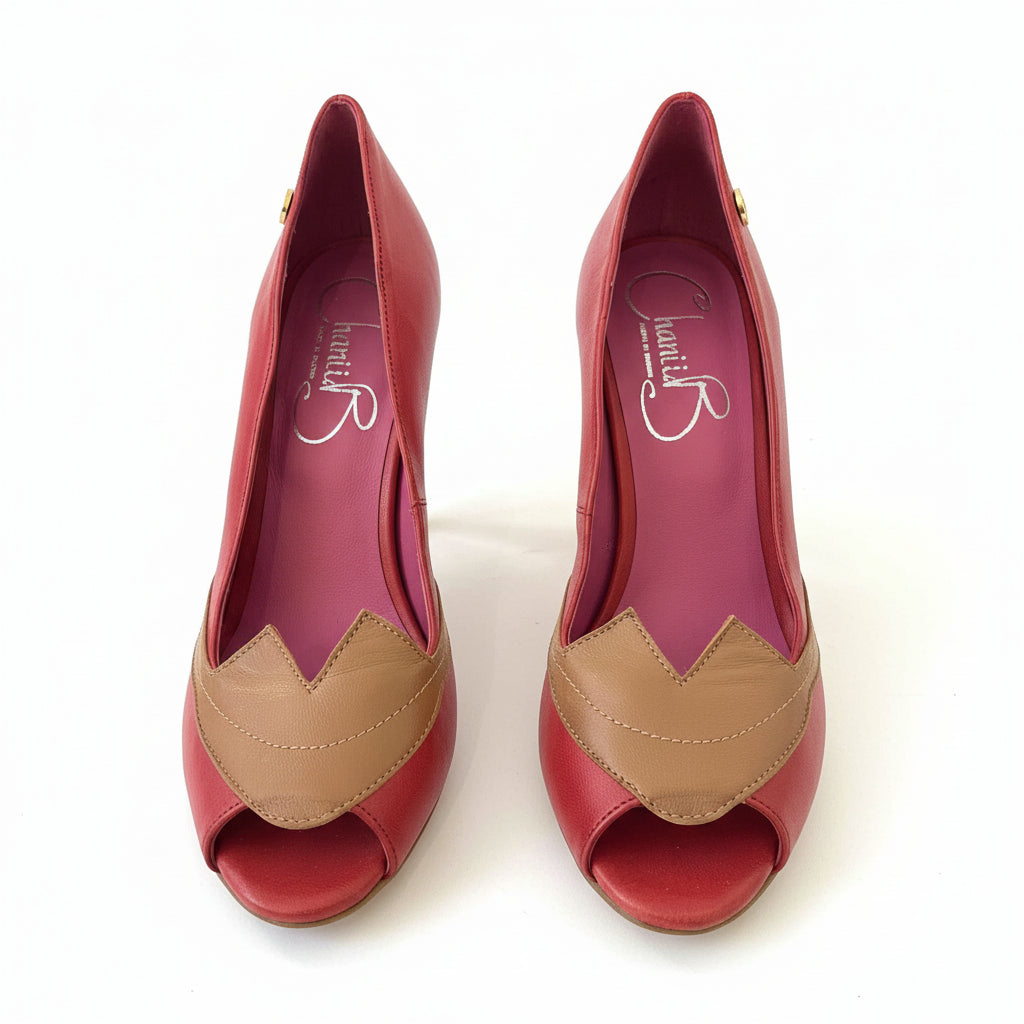front view of Red and tan peep-toe heels with a distinctive lip-shaped pattern front