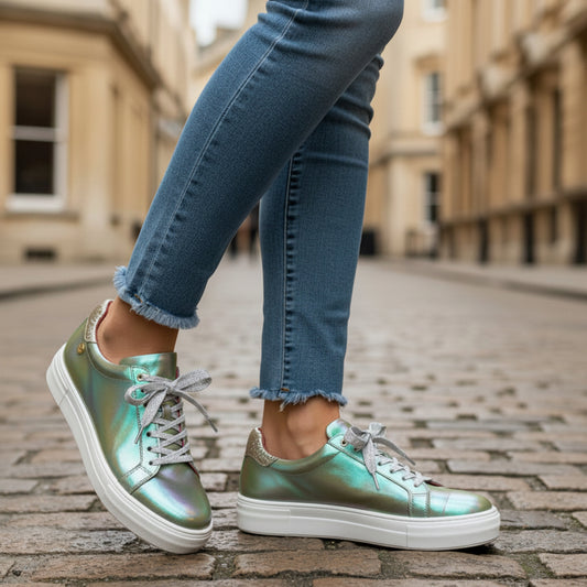 Iridescent sneaker with white laces on a white background