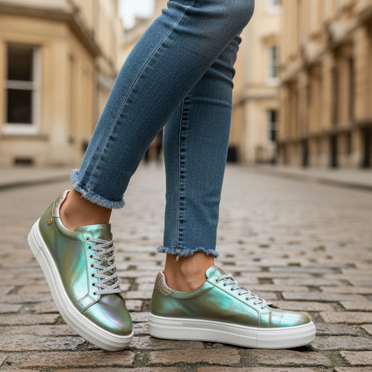 Iridescent sneaker with white laces on a white background