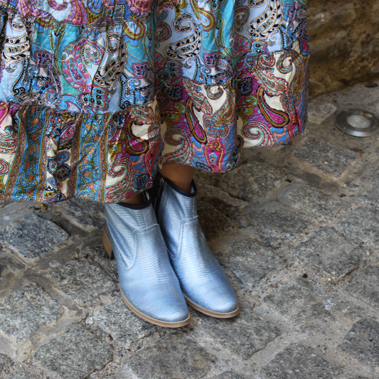 A pair of Designer Boots named Zipp - Ice Blue Iridescent