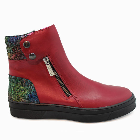 A red leather ankle boot with silver zip and popper details, with a flat sole.