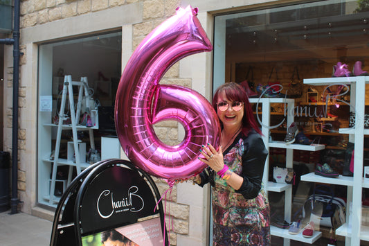 Celebrating our shop's birthday with a fuchsia balloon in true Chanii B style.