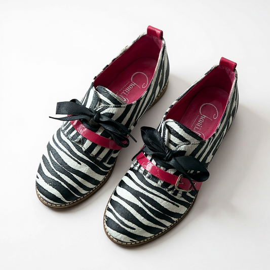 Excuse moi - Zebra cow hide lace up shoe