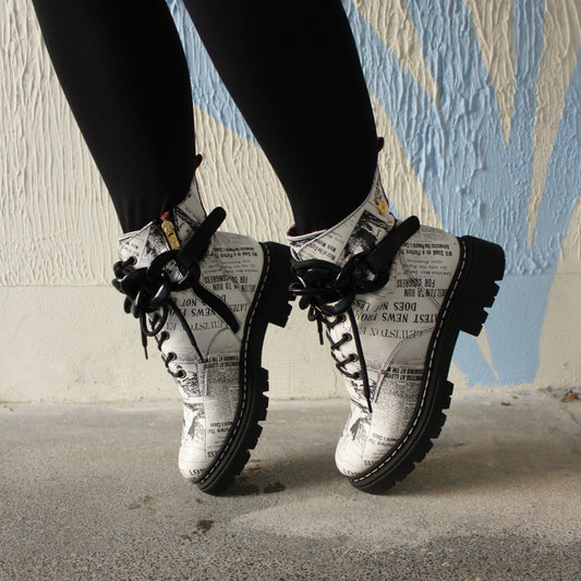 white newspaper printed lace up combat boot