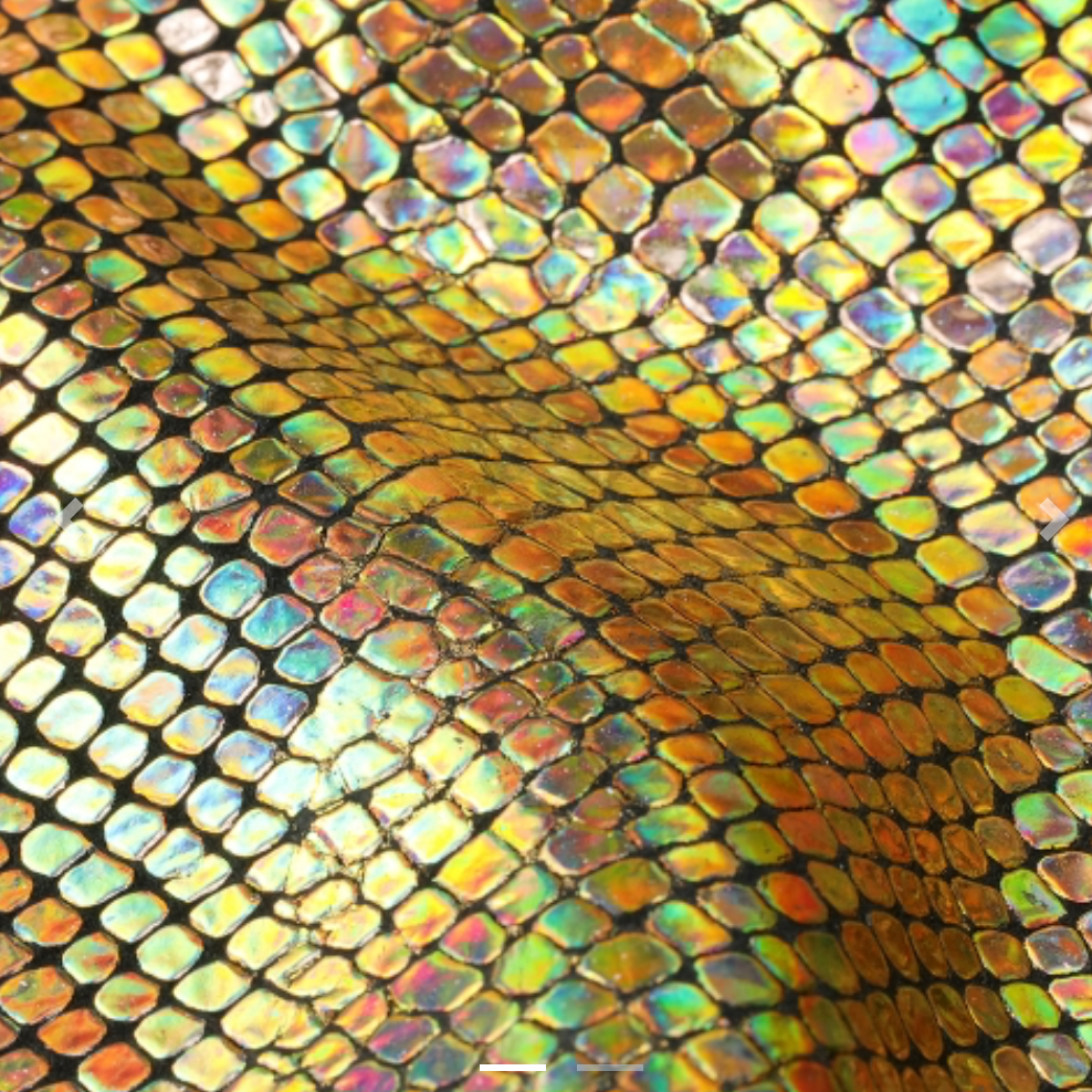 gold-embossed leather material swatch with text fields on the right. The screenshot is taken from a Safari browser on an Apple Mac, with the Safari menu and macOS icons visible at the top and bottom.