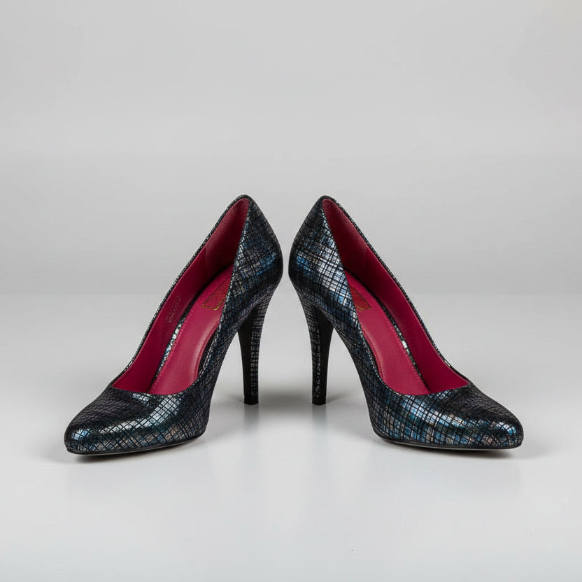 Pair of black high-heeled shoes with red interior on a light gray background