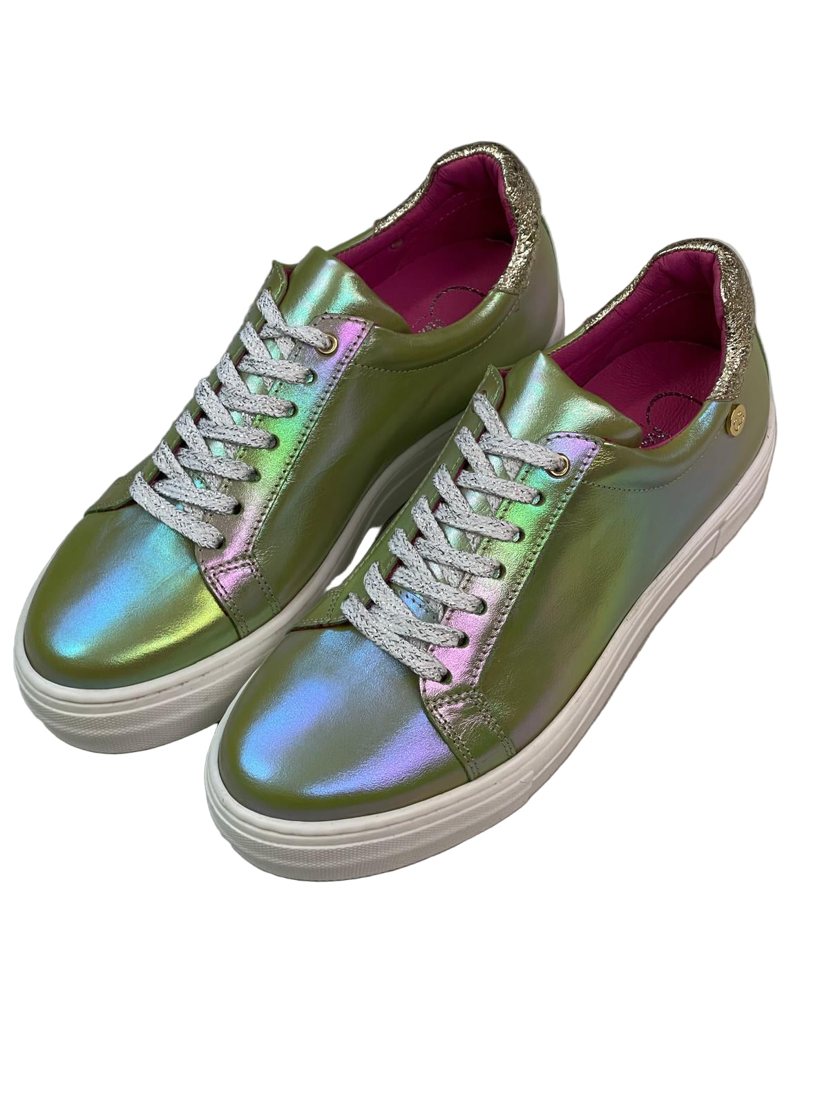 Iridescent green sneakers with white laces on a light gray background