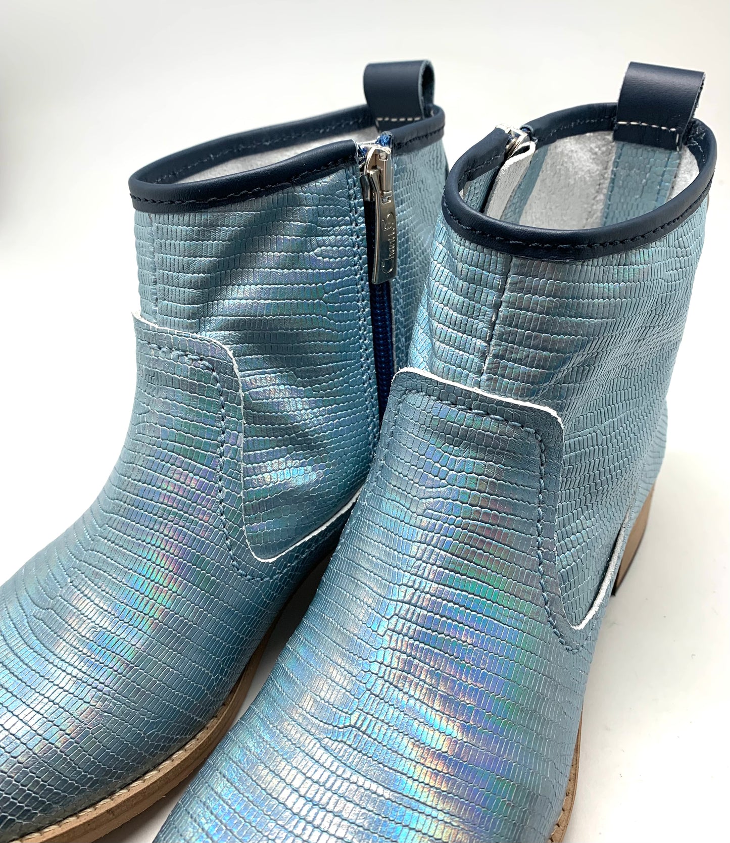 A pair of Designer Boots named Zipp - Ice Blue Iridescent