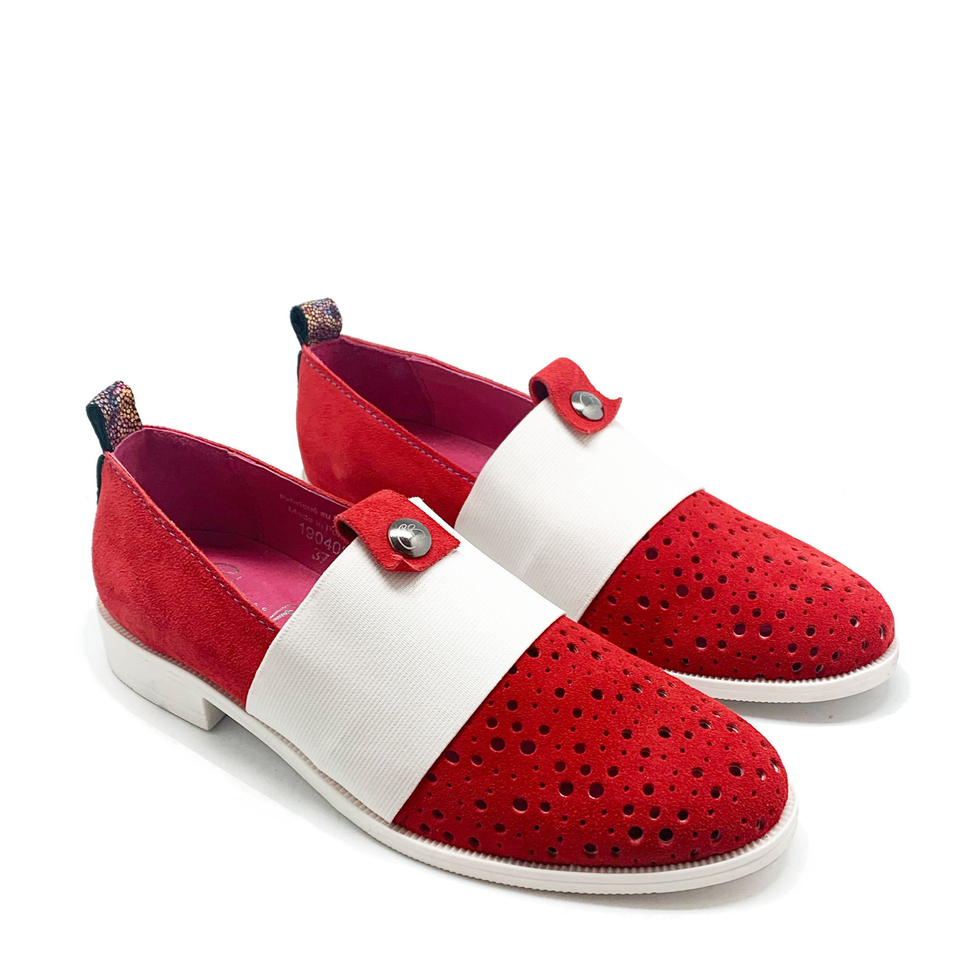 Red perforated suede slip on shoes with white elastic strap. View of both shoes.